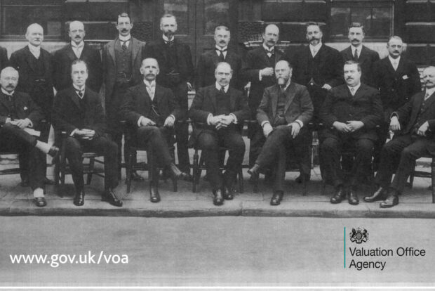 The first staff members of the organisation that would become the Valuation Office Agency are arranged in two rows: standing and seated.